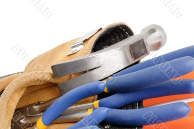cropped image of tool belt with hammer and wrench