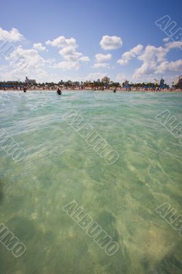 view of sea with people at beach in background