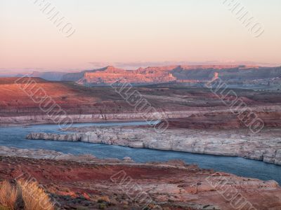 mountain range and water stream with clear sky in background