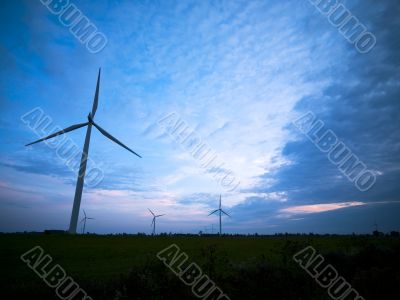 view of wind turbines at dusk