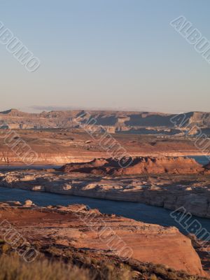 high angle view of mountain range and water stream with clear sky in background