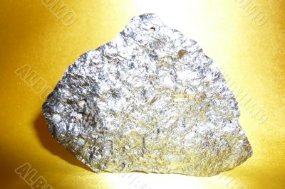 Silvery stone on a gold background.