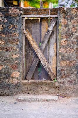 Wood Door Embedded in Stone