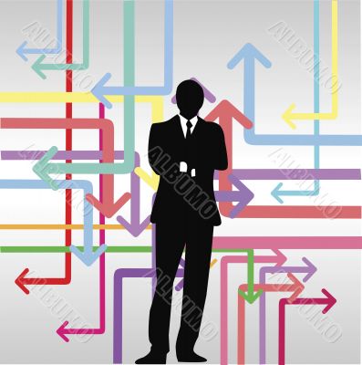 businessman standing in front of colorful arrow signs