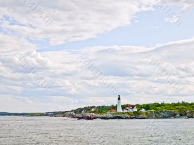 Lighthouse and Cloudy Sky