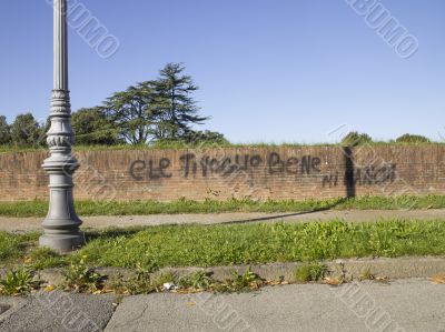 brick wall with writings on it