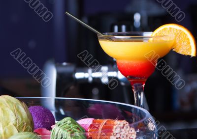 Orange cocktail with a straw