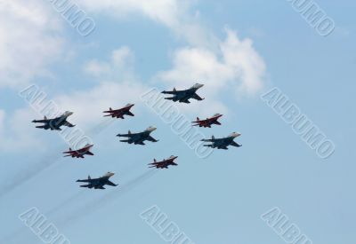 Aerobatic  group on the background of white clouds