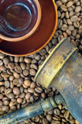 Coffee pot, cup and coffee beans close-up