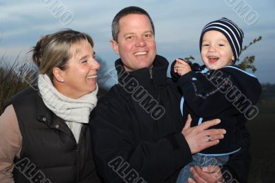 Family picture - parents with 2 year old son -