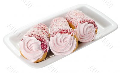 Cake with pink cream on a plate