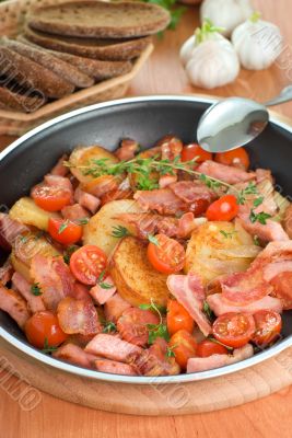 Fried potatoes with meat and vegetables