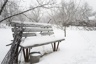 Snow-covered bench