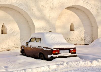Abandoned car in winter