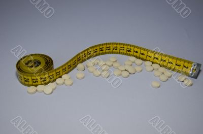 Measuring tape and pills-2