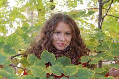 Young woman with autumn leaves