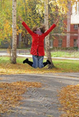 Young woman with autumn leaves