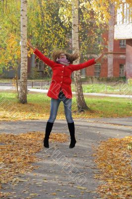 Young woman with autumn leaves