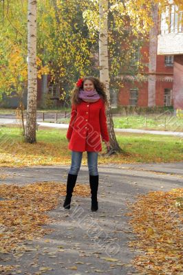 Young woman with autumn leaves