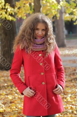 Young woman with autumn leaves