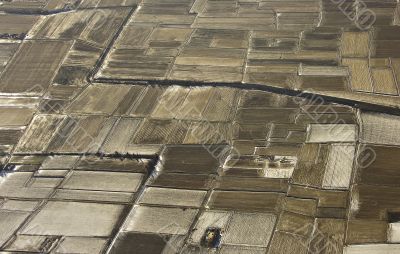 Light snow on plowed fields