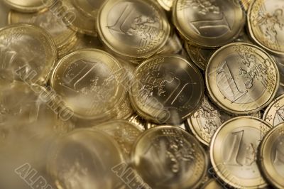 Euro coins drown in water and fog