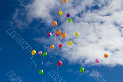 Lots of colorful balloons in the sky 