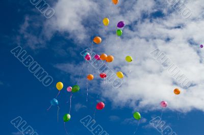 Colorful balloons in the sky.