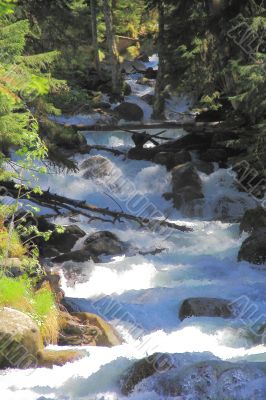 Waterfall in Caucasus mountains