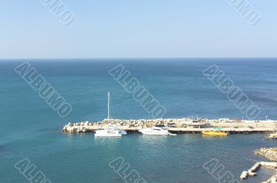 Yacht pier at the sunny summer morning
