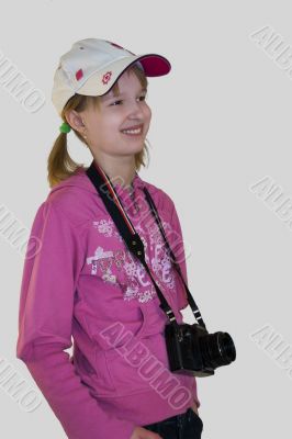 Smiling girl with a camera
