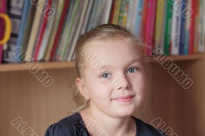 Beautiful girl on books background