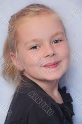 Beautiful girl with blond hair and blue eyes