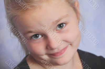 Beautiful girl with blond hair and blue eyes