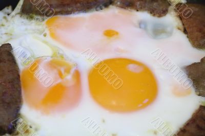 Fried eggs and meat for breakfast