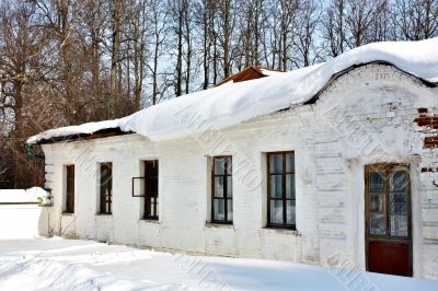 Old estate with snow on the roof