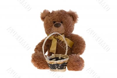 Toy teddy bear with a basket.