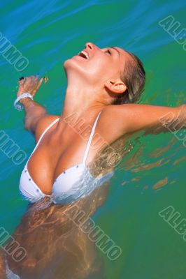 Sexual girl bathes in the sea
