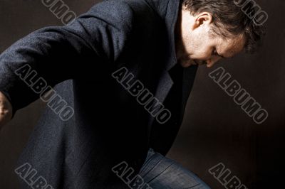 A man running on a dark background