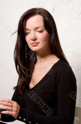 Portrait of the young brunette woman