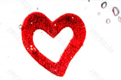 Valentine with red heart in water