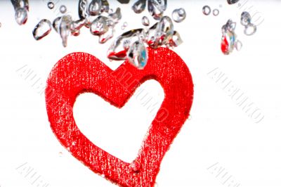 Valentine with red heart in water