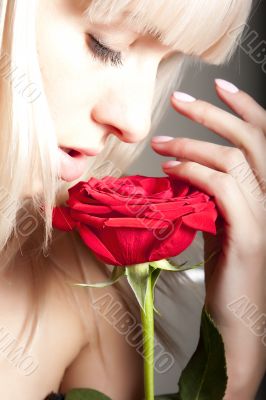 Woman smelling a rose