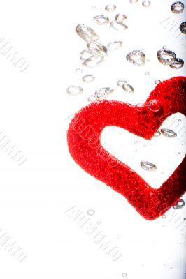 Valentine with red heart in water