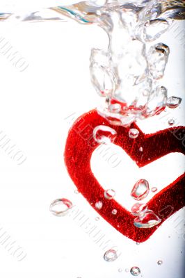 Valentine with red heart in water