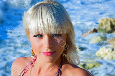 The beautiful girl against the sea