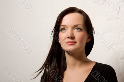 Portrait of the young brunette woman