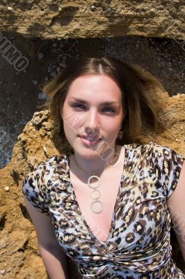 beautiful woman on stone beach