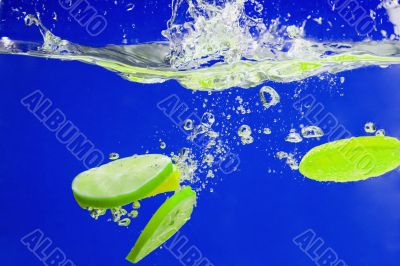YELLOW citrus SPLASHING IN WATER 