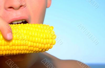 man eating corn